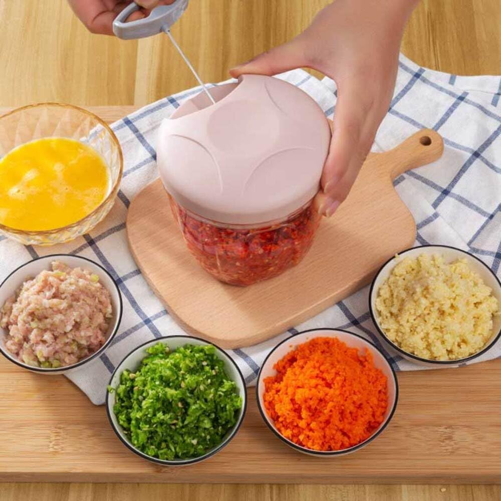 Hachoir manuel rose avec plusieurs varietes aliments haches- IntelliCuisine